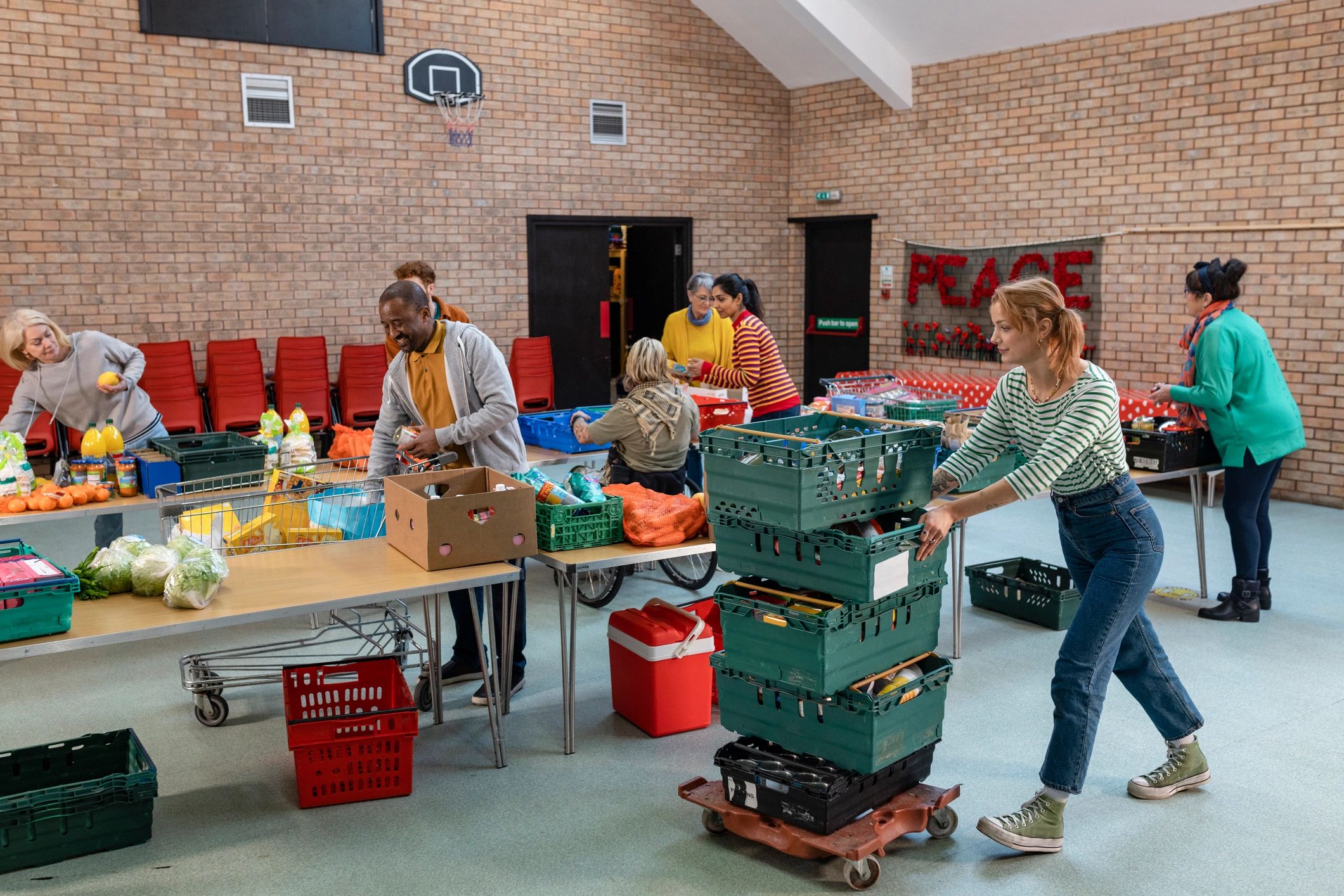 Volunteers sorting food donations for pantry assistance